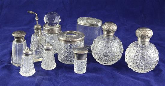 A pair of late Victorian silver mounted hobnail cut glass globular scent bottles,